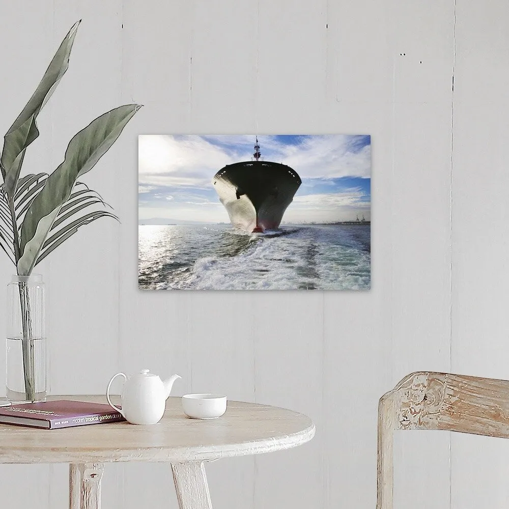 "Bow view of cargo ship sailing out of port." Canvas Wall Art
