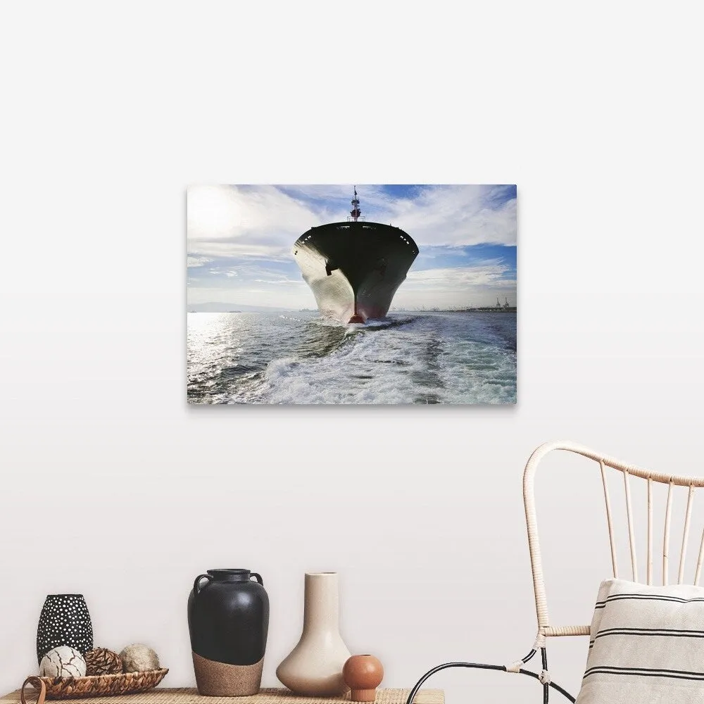 "Bow view of cargo ship sailing out of port." Canvas Wall Art