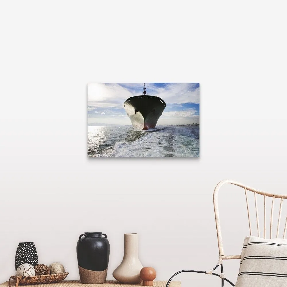 "Bow view of cargo ship sailing out of port." Canvas Wall Art